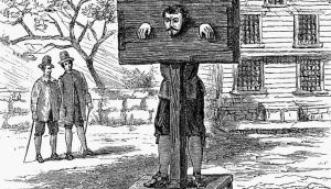 Даниэль Дефо прикован к позорному столбу за преступление «крамольной клеветы» после публикации брошюры политико-сатирических памфлетов, но был забросан цветами